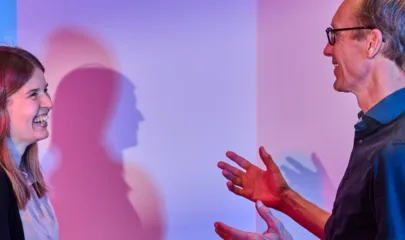 Two people having a conversation header photo
